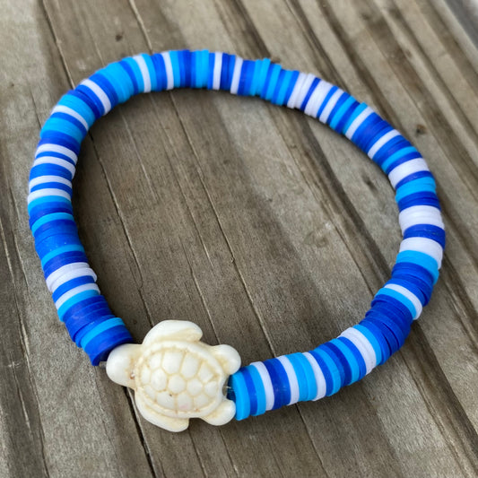 Blue clay beaded bracelet with turtle charm