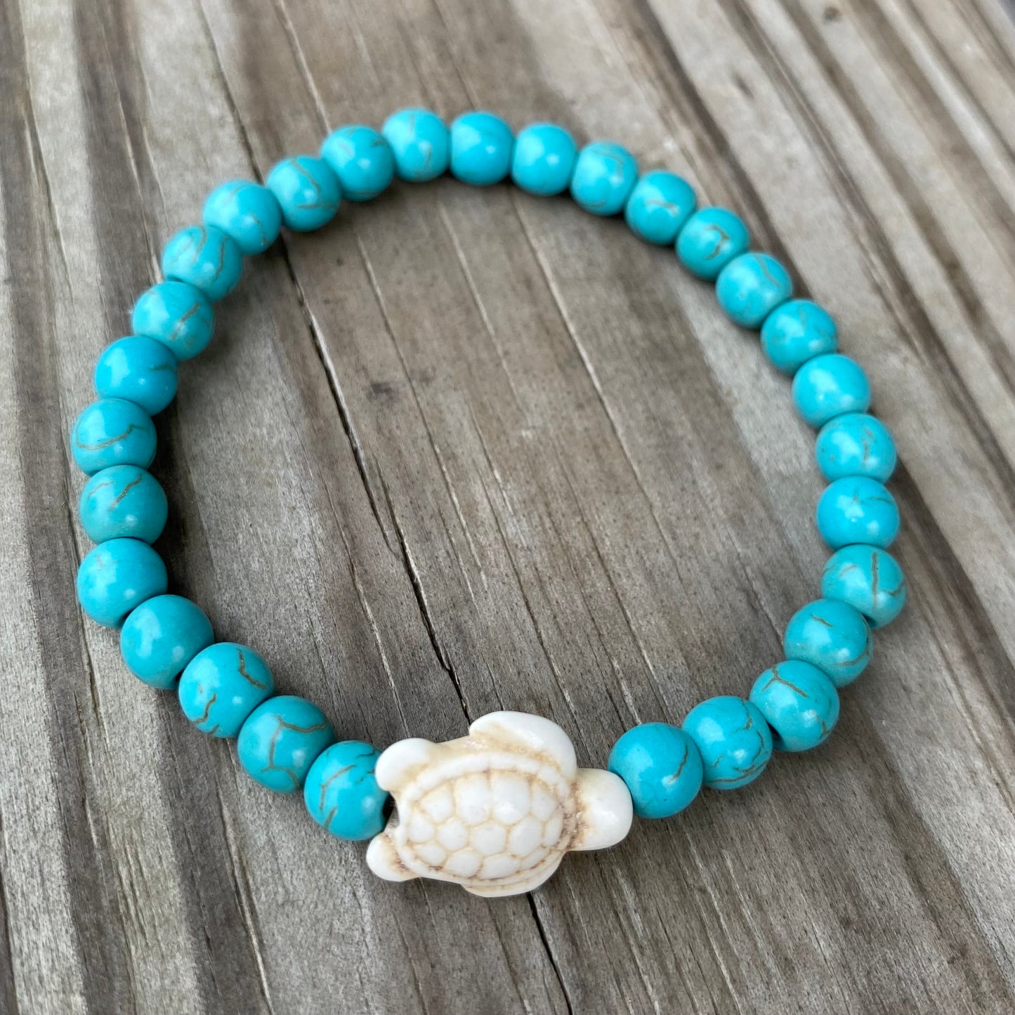 Turquoise bracelet with turtle charm