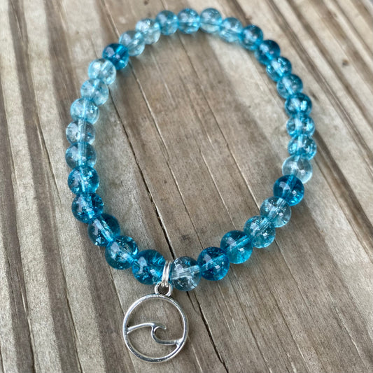 Blue glass beaded bracelet with charm