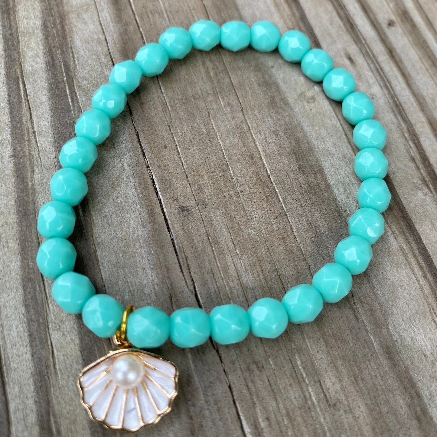 Turquoise bracelet with clamshell charm